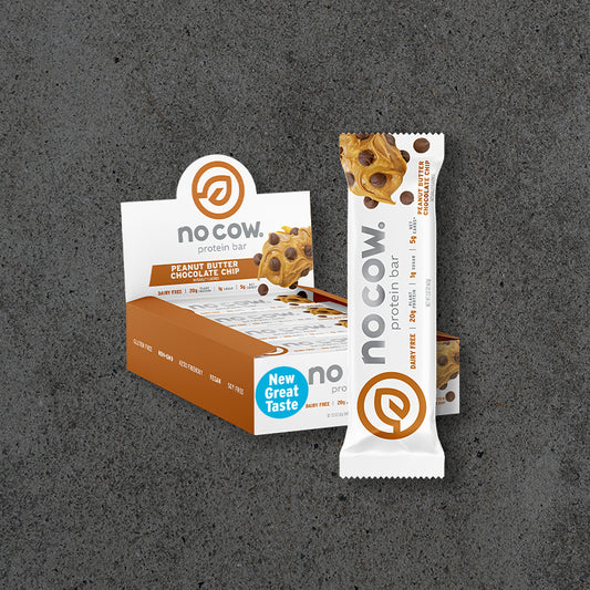 nocow peanut butter chocolate chip protein bar packaging on a gray background