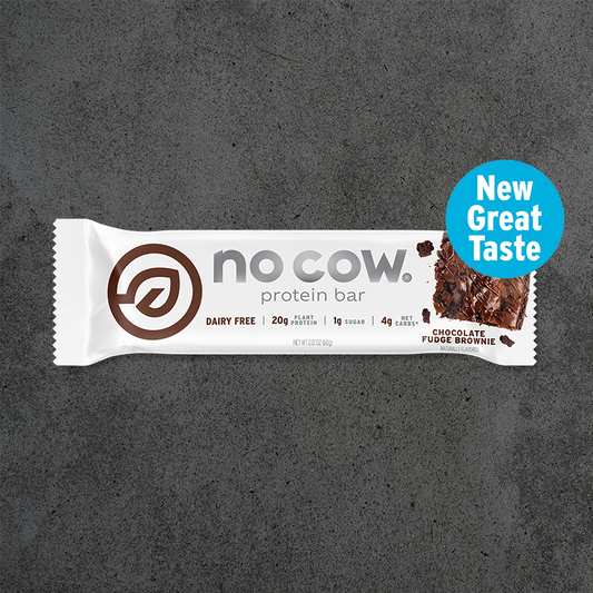 No Cow protein bar packaging on a dark gray background